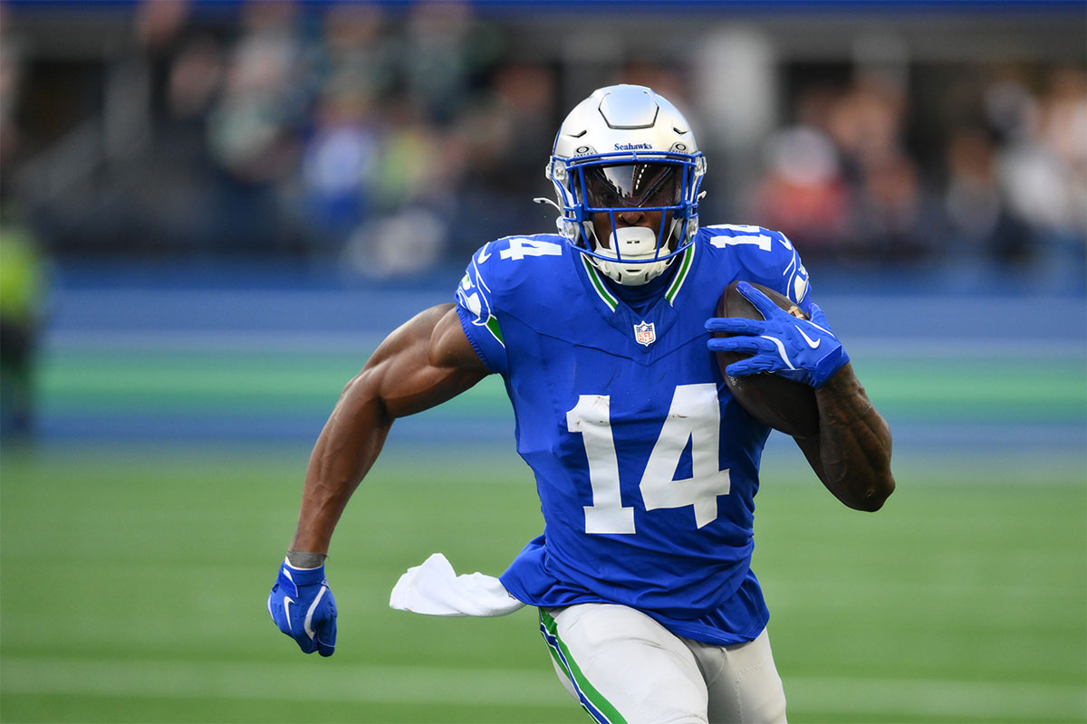 Seattle Seahawks wide receiver DK Metcalf (14) carries the ball after a sack during the first half against the San Francisco 49ers at Lumen Field.