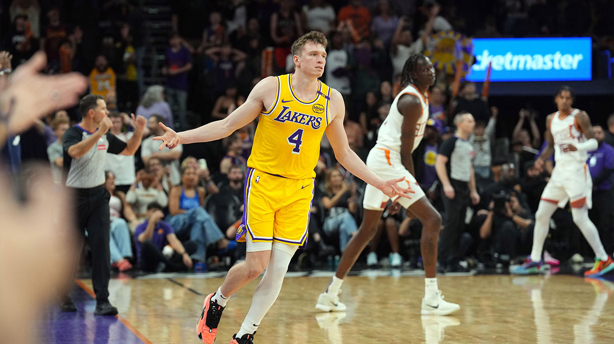 Los Angeles Lakers guard Dalton Knecht (4) reacts after making a three point basket against the Phoenix Suns during the overtime period at Footprint Center. 