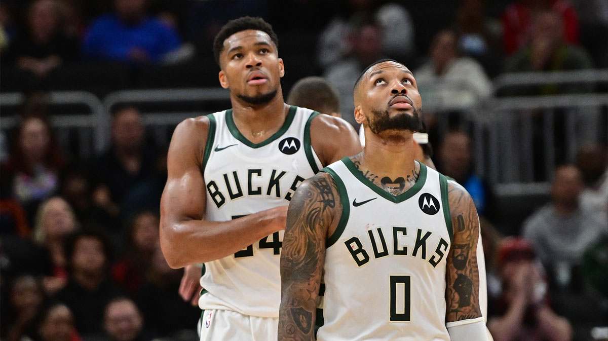 Milwaukee Bucks forward Giannis Antetokounmpo (34) and guard Damian Lillard (0) look on in the second quarter against the Chicago Bulls at Fiserv Forum.