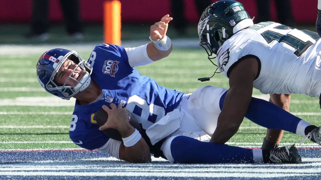 New York Giants quarterback Daniel Jones (8) sacked by Philadelphia Eagles linebacker Nakobe Dean (17) during the second half at MetLife Stadium.