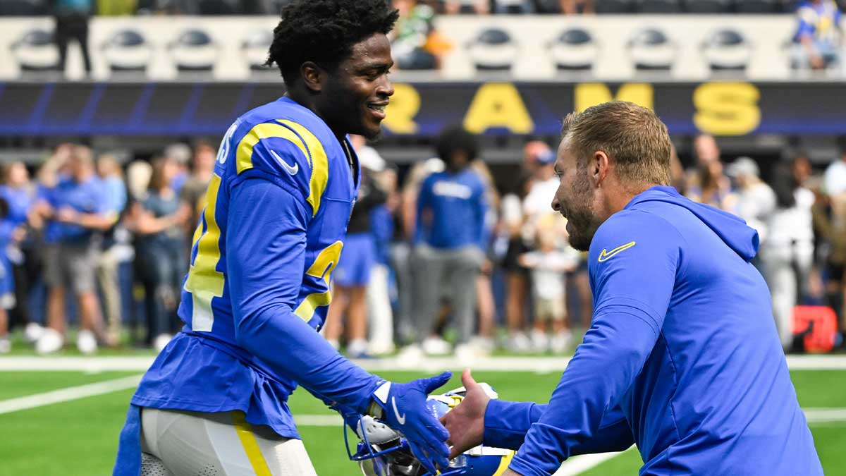 Los Angeles Rams head coach Sean McVay greets cornerback Darious Williams (24) before an NFL game against the Green Bay Packers at SoFi Stadium.