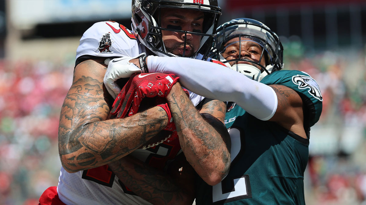 Tampa Bay Buccaneers wide receiver Mike Evans (13) runs with the ball as Philadelphia Eagles cornerback Darius Slay Jr. (2) defends during the first half at Raymond James Stadium.
