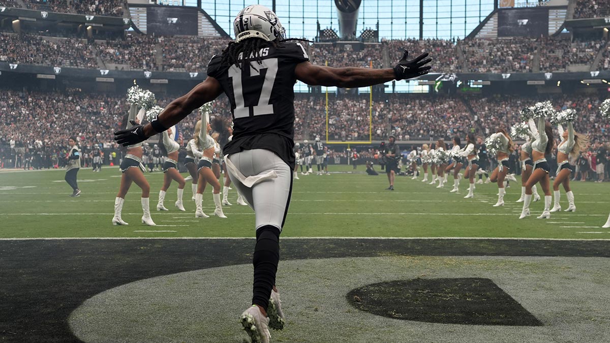 Las Vegas Raiders wide receiver Davante Adams (17) enters the field before the game against the Carolina Panthers at Allegiant Stadium.