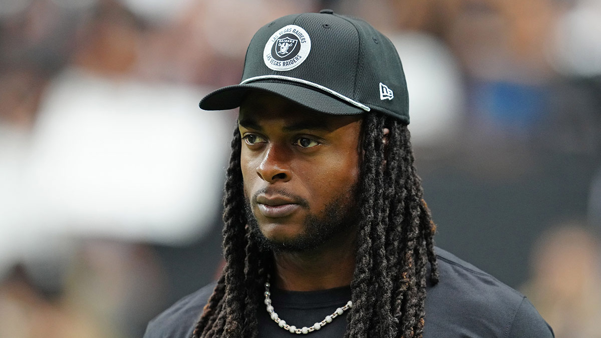 Las Vegas Raiders wide receiver Davante Adams (17) walks the sideline before the start of a game between the Raiders and the Cleveland Browns at Allegiant Stadium.