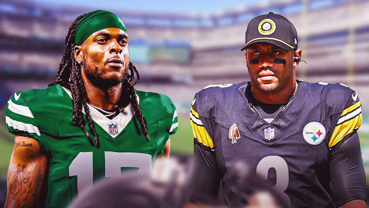 Davante Adams in New York Jets attire without a helmet talking to Russell Wilson after the game.