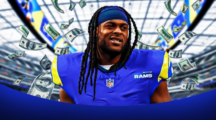 Davante Adams surrounded by piles of cash.