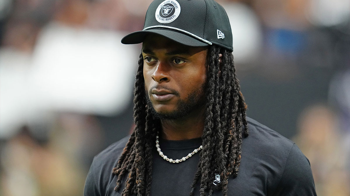 Las Vegas Raiders wide receiver Davante Adams (17) walks the sideline before the start of a game between the Raiders and the Cleveland Browns at Allegiant Stadium.