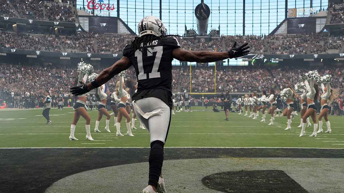 Las Vegas Raiders wide receiver Davante Adams (17) enters the field before the game against the Carolina Panthers at Allegiant Stadium.