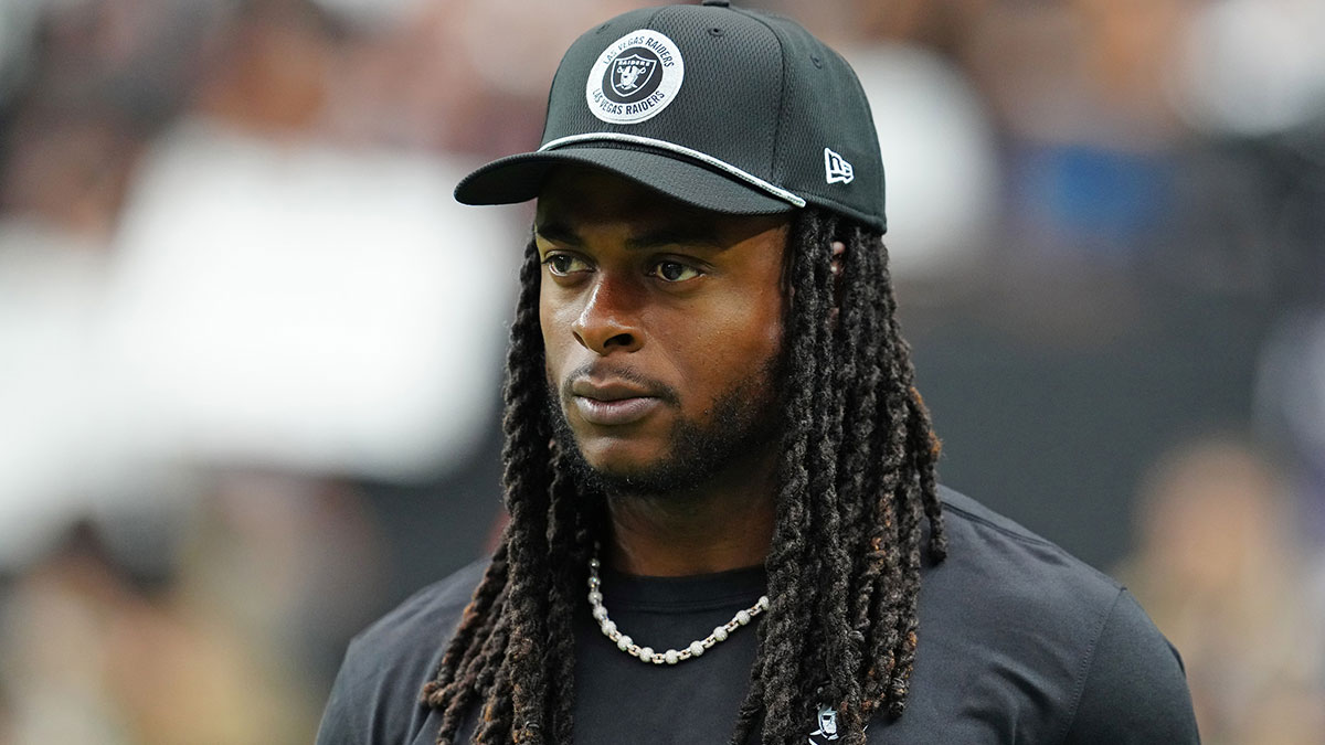 Las Vegas Raiders wide receiver Davante Adams (17) walks the sideline before the start of a game between the Raiders and the Cleveland Browns at Allegiant Stadium.