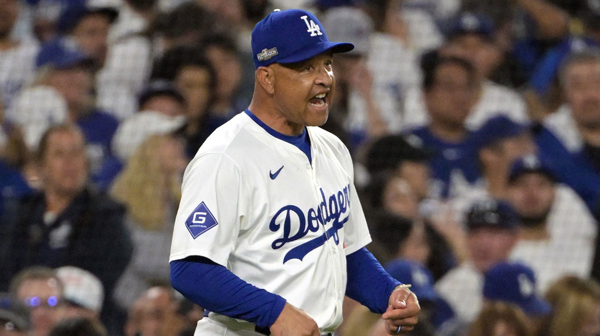 Los Angeles Dodgers manager Dave Roberts (30) reacts in the eighth inning against the San Diego Padres during game five of the NLDS for the 2024 MLB Playoffs at Dodger Stadium.