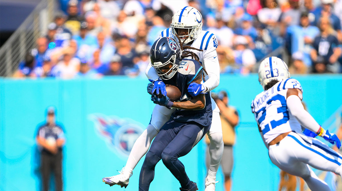 Oct 13, 2024; Nashville, Tennessee, USA; Indianapolis Colts cornerback Jaylon Jones (40) tackles Tennessee Titans wide receiver DeAndre Hopkins (10) after a made catch during the first half at Nissan Stadium.