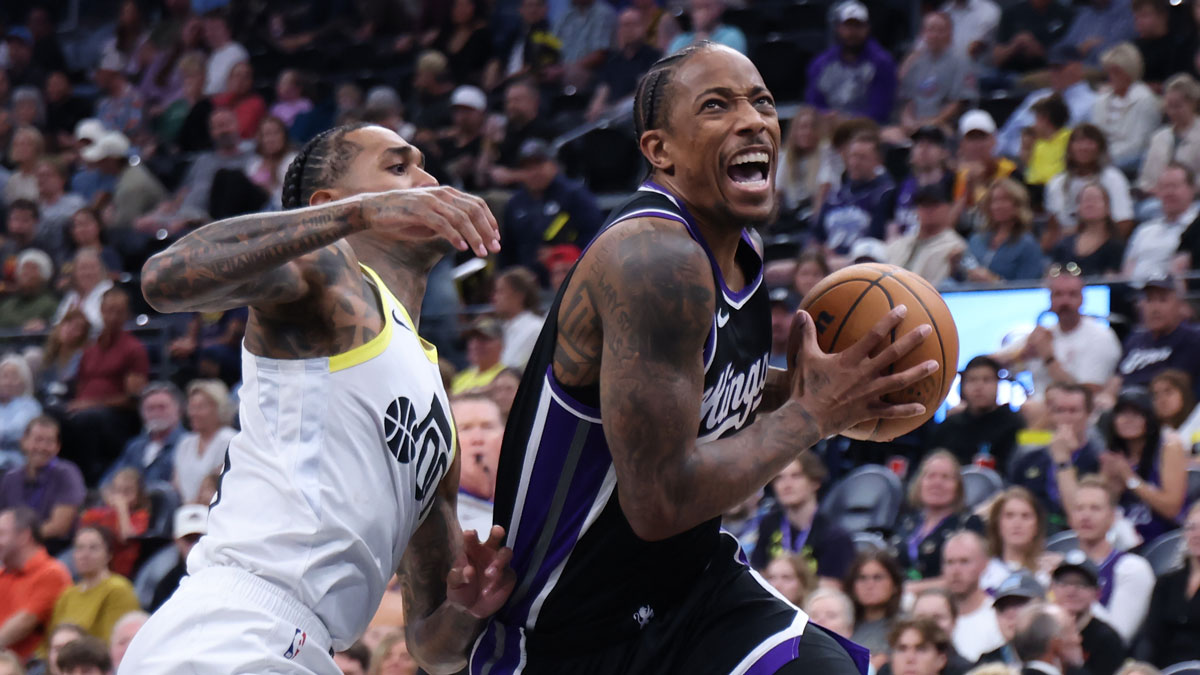 Sacramento Kings forward DeMar DeRozan (10) drives Utah Jazz guard Jordan Clarkson (00) during the fourth quarter at the Delta Center.