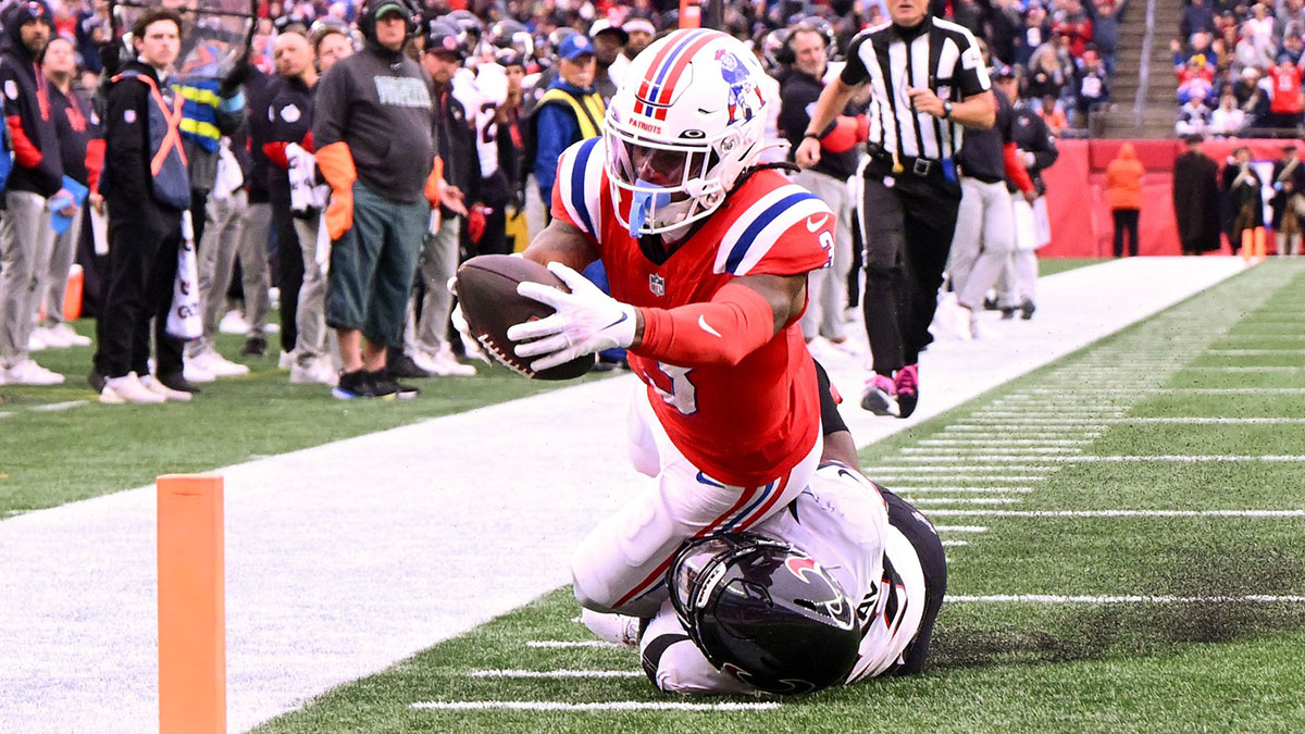 New England Patriots wide receiver DeMario Douglas (3) scores a touchdown against the Houston Texans during the second half at Gillette Stadium.