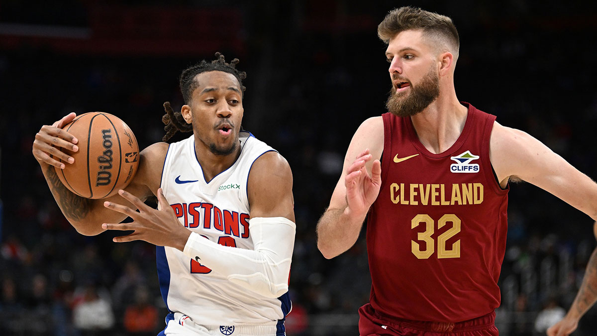Detroit Pistons guard Daniss Jenkins (24) drives past Cleveland Cavaliers forward Dean Wade (32) in the third quarter at Little Caesars Arena.