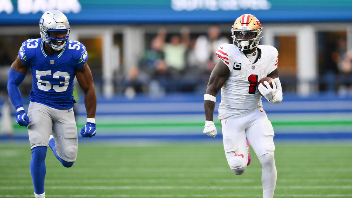 San Francisco 49ers wide receiver Deebo Samuel Sr. (1) runs away from Seattle Seahawks linebacker Boye Mafe (53) to score a 76-yard touchdown during the first half at Lumen Field.