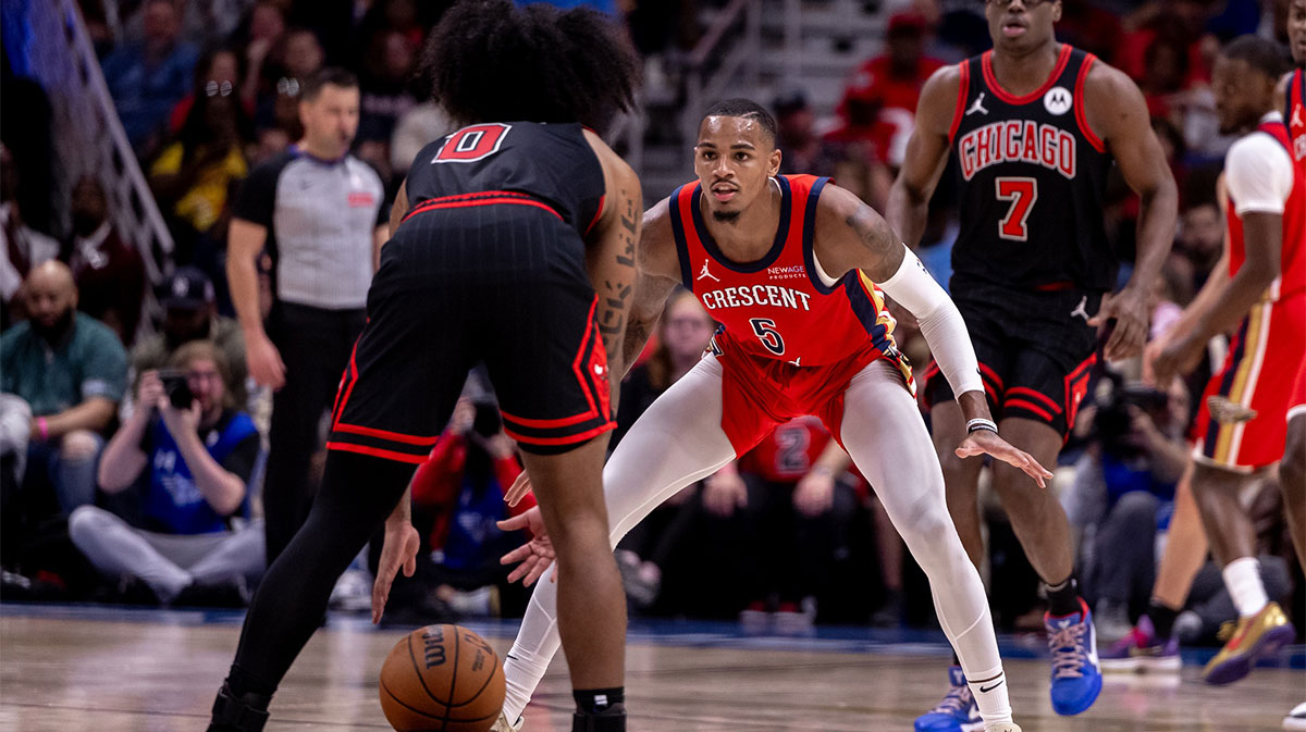 New Orleans Pelicans guard Dejounte Murray (5) guards Chicago Bulls guard Coby White (0) during the second half at Smoothie King Center.