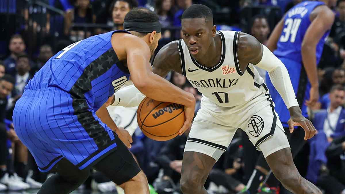 Brooklyn Nets guard Dennis Schroder (17) defends Orlando Magic guard Jalen Suggs (4) during the second quarter at Kia Center.