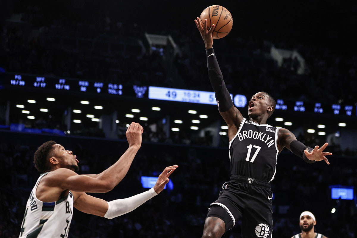 Brooklyn Nets guard Dennis Schroder (17) drives past Milwaukee Bucks forward Giannis Antetokounmpo (34) in the third quarter at Barclays Center.