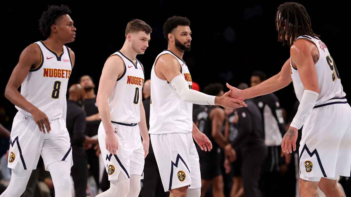 Denver Nuggets guard Jamal Murray (27) celebrates with forward Aaron Gordon (50) and forward Peyton Watson (8) and guard Christian Braun (0) during the third quarter at Barclays Center.