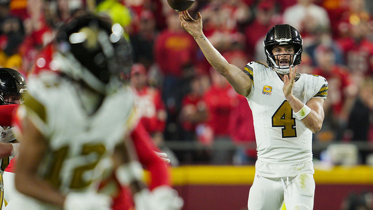 Oct 7, 2024; Kansas City, Missouri, USA; New Orleans Saints quarterback Derek Carr (4) throws a pass during the second half against the Kansas City Chiefs at GEHA Field at Arrowhead Stadium. 