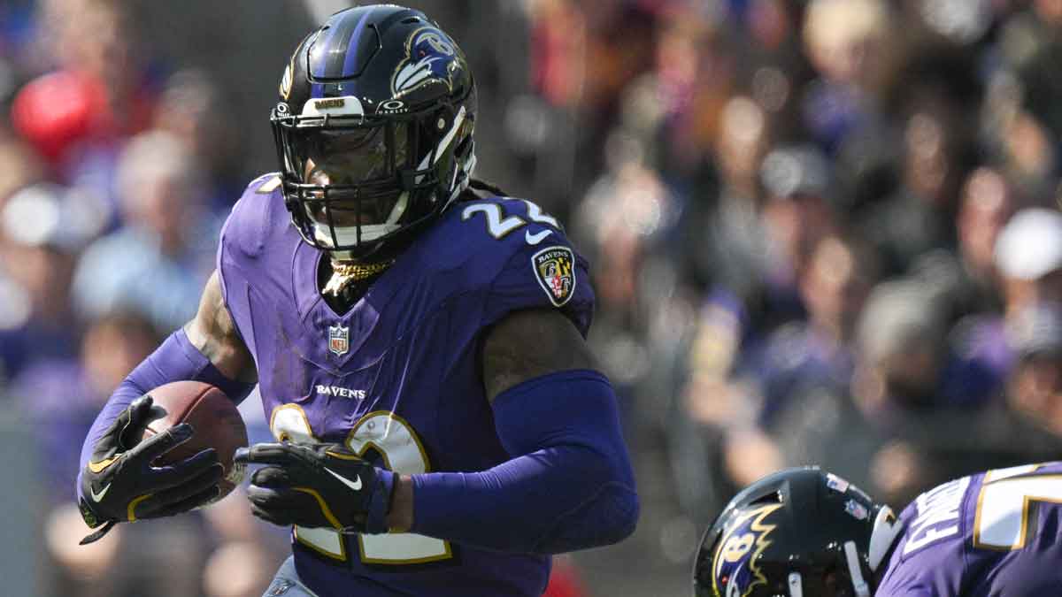 Oct 13, 2024; Baltimore, Maryland, USA; Baltimore Ravens running back Derrick Henry (22) rushes during the first half against the Washington Commanders at M&T Bank Stadium.