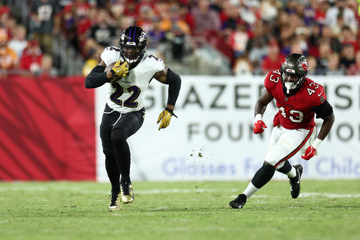 Oct 21, 2024; Tampa, Florida, USA; Baltimore Ravens running back Derrick Henry (22) runs with the ball against the Tampa Bay Buccaneers in the third quarter at Raymond James Stadium.