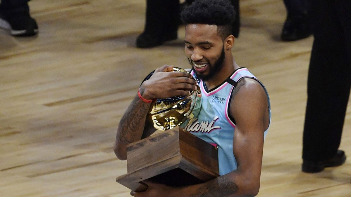 Miami Heat player Derrick Jones, Jr. celebrates with the trophy after winning the slam dunk contest during NBA All Star Saturday Night at United Center.