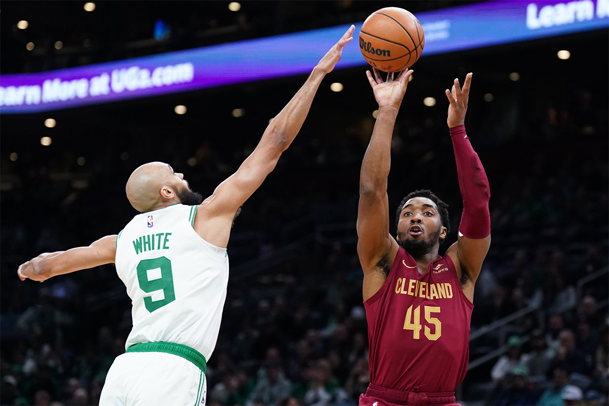 Cleveland Cavaliers guard Donovan Mitchell (45) shoots against Boston Celtics guard Derrick White (9) in the first quarter at TD Garden