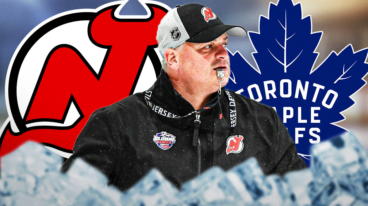 Sheldon Keefe in image looking thoughtful, New Jersey Devils and Toronto Maple Leafs logos, hockey rink in background