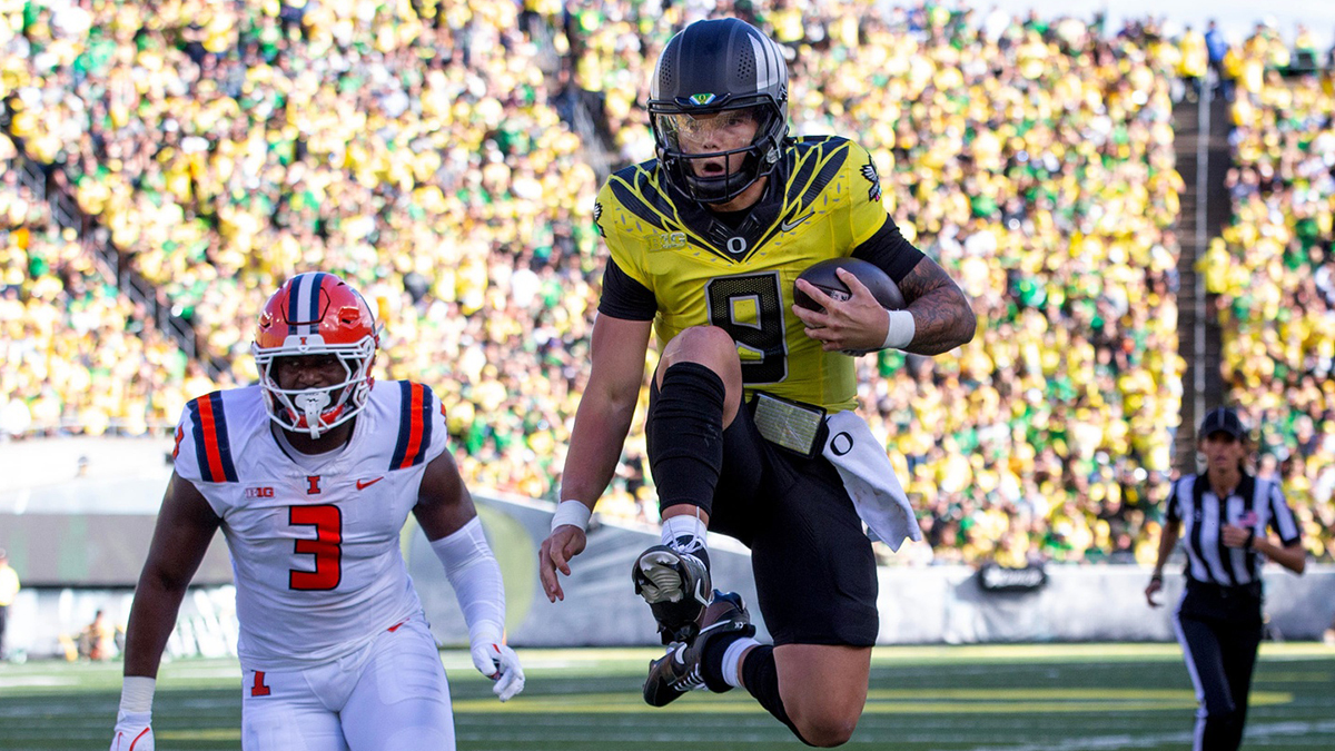 Dillon Gabriel skips to the end zone during Oregon's home win over Illinois