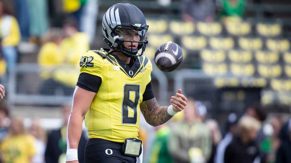 Oregon quarterback Dillon Gabriel twirls the ball as the No. 1 Oregon Ducks host the No. 21 Illinois Fighting Illini