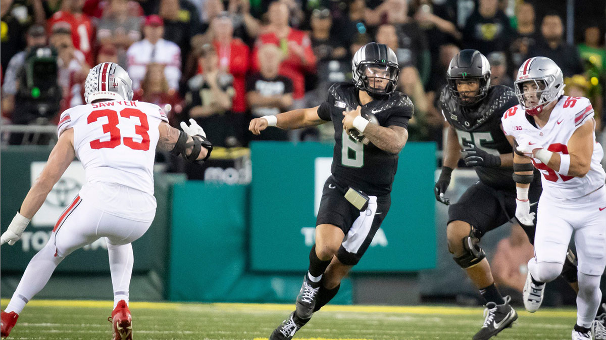 Oregon Ducks quarterback Dillon Gabriel carries the ball as the No. 3 Oregon Ducks host the No. 2 Ohio State Buckeyes