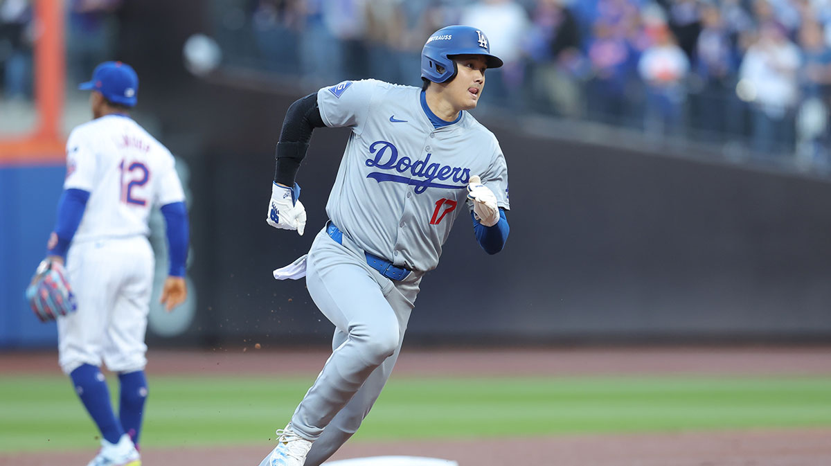 Los Angeles Dodgers two-way player Shohei Ohtani (17) runs to third base in the first inning against the New York Mets during game five of the NLCS for the 2024 MLB playoffs at Citi Field