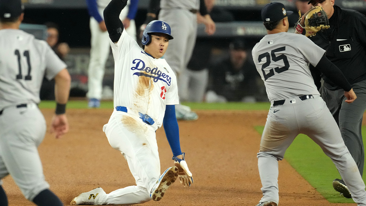 Los Angeles Dodgers designated hitter Shohei Ohtani (17) attempts to steal second base against New York Yankees second baseman Gleyber Torres (25) in the seventh inning for game two of the 2024 MLB World Series at Dodger Stadium. 