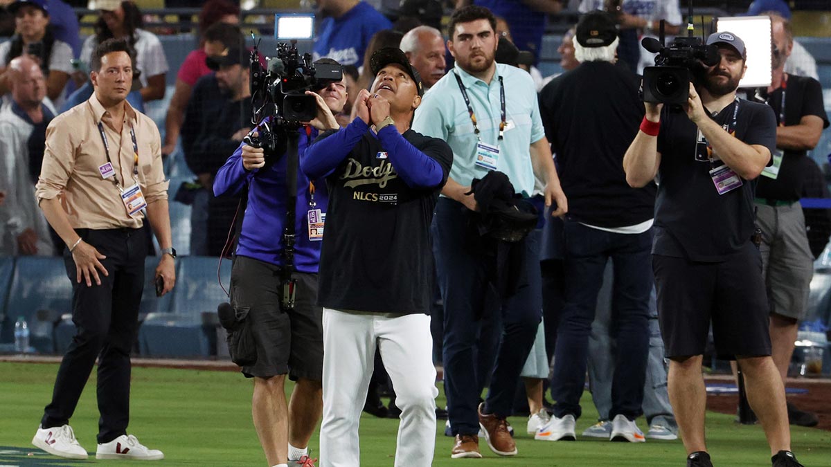 Dodgers manager Dave Roberts (30) celebrates after defeating the San Diego Padres during game five of the NLDS for the 2024 MLB Playoffs at Dodger Stadium