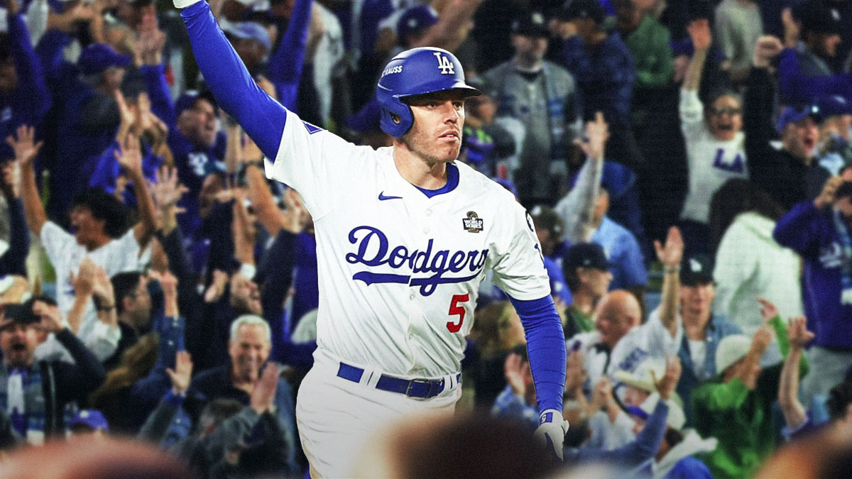 Freddie Freeman with arms raised, celebrating