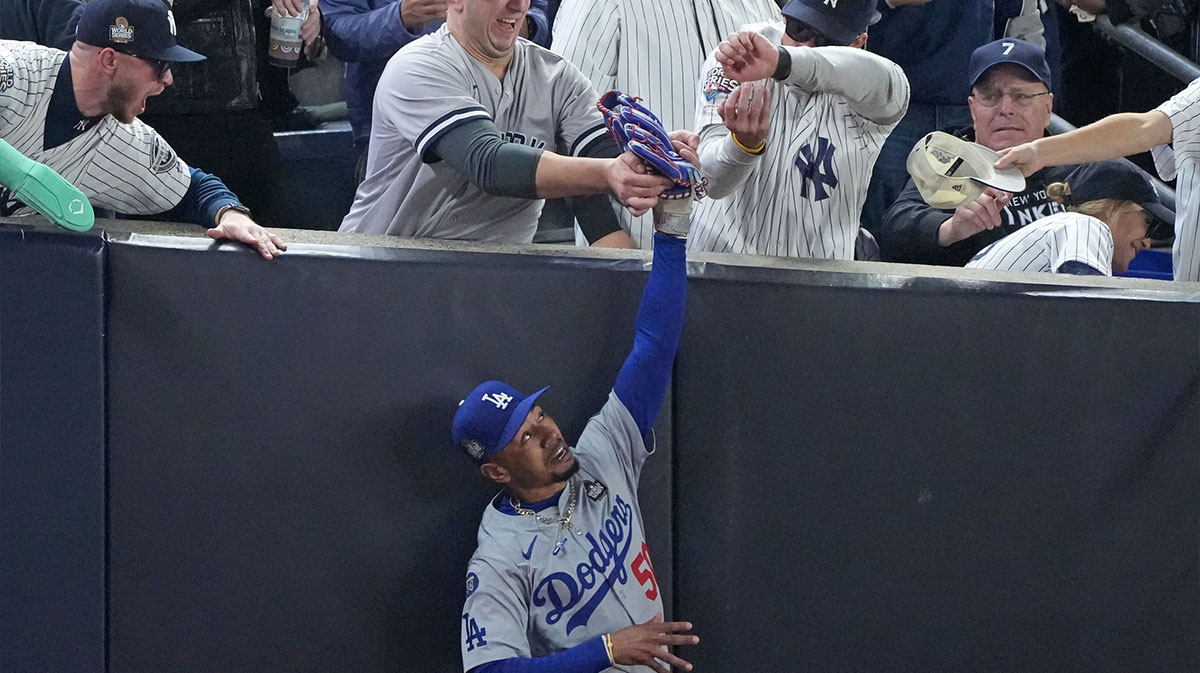 Dodgers outfielder Mookie Betts (50) makes a catch in foul terriotory against the New York Yankees in the first inning during game four of the 2024 MLB World Series at Yankee Stadium