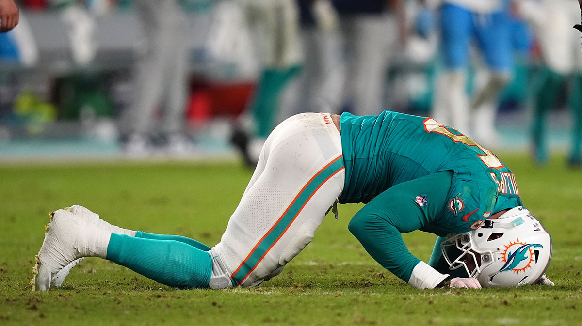 Miami Dolphins linebacker Jaelan Phillips (15) reacts after an apparent injury during the second half against the Tennessee Titans at Hard Rock Stadium