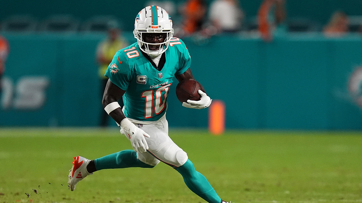 Miami Dolphins wide receiver Tyreek Hill (10) runs with the ball during the first half against the Tennessee Titans at Hard Rock Stadium. 