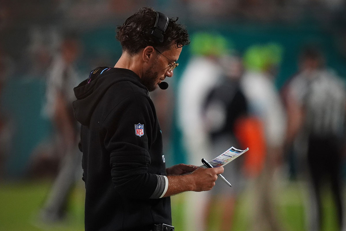 Dolphins head coach Mike McDaniel looks over his play card during the second half against the Tennessee Titans at Hard Rock Stadium
