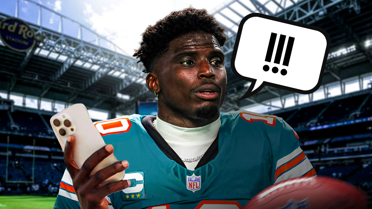 Dolphins' Tyreek Hill talking on a cell phone with a talk bubble with !!!