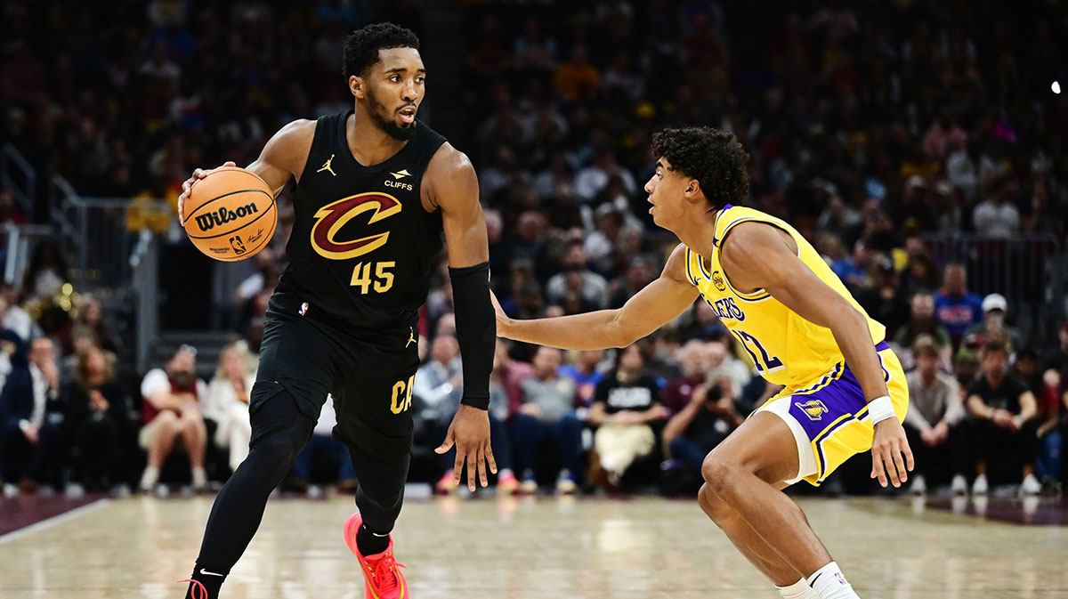 Los Angeles Lakers guard Max Christie (12) defends Cleveland Cavaliers guard Donovan Mitchell (45) during the first half at Rocket Mortgage FieldHouse.