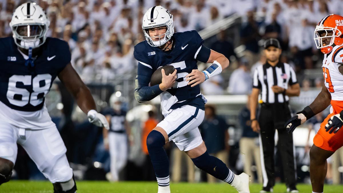 Penn State quarterback Drew Allar (15) scramble with the ball before attempting a short pass in the first quarter of a Big Ten football game against Illinois