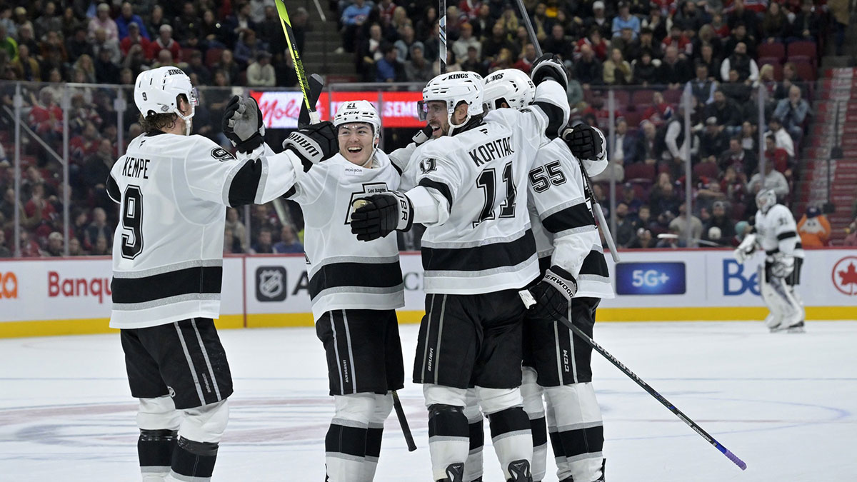 Los Angeles Kings defenseman Andreas Englund (5) celebrates with teammates including forward Anze Kopitar (11) and forward Adrian Kempe (9) after scoring a goal against the Montreal Canadiens during the third period at the Bell Centre.