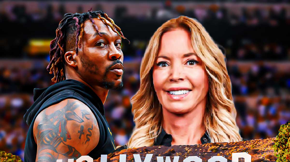 Dwight Howard looking serious, with Lakers owner Jeanie Buss smiling