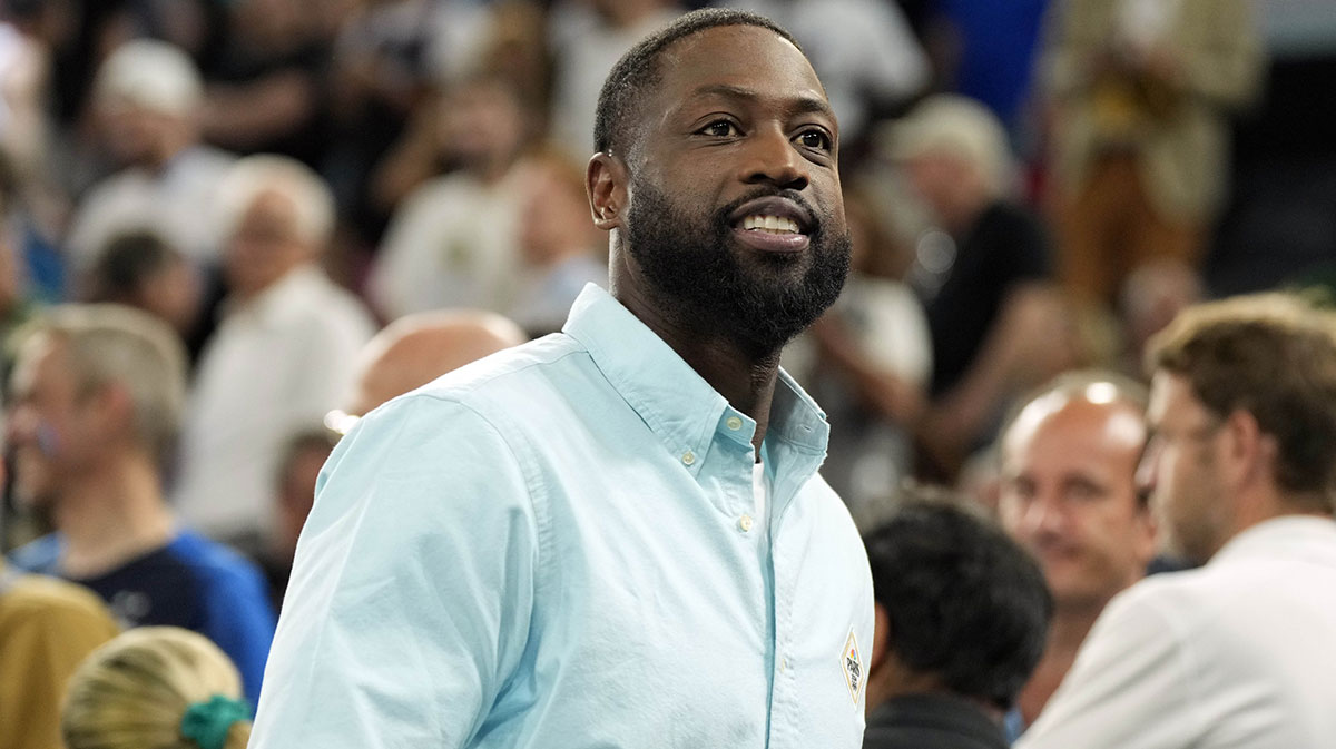 Miami Heat greats Alonzo Mourning, Udonis Harlem and Dwyane Wade participate in the Pat Riley Court Dedication Ceremony during halftime at Kasia Center.