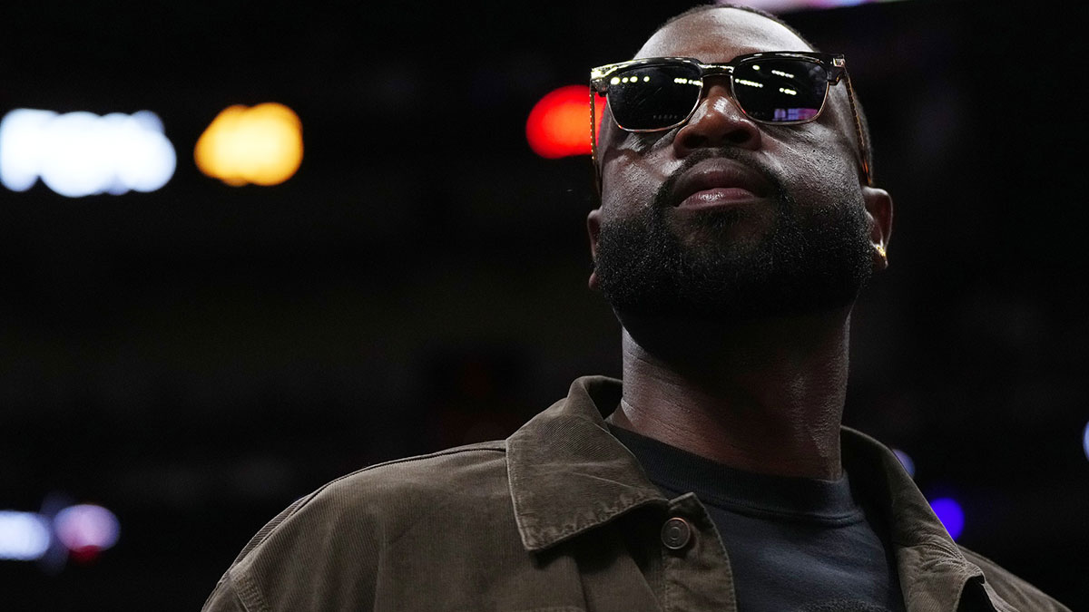 Former Miami Heat player Dwayne Wade walks court-side during the second half of the game between the Miami Heat and the Atlanta Hawks at Kaseya Center.