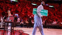 Former Miami Heat guard Dwyane Wade is honored with 'Dwayne Wade Blvd' at halftime during a game against the Detroit Pistons at Kaseya Center.