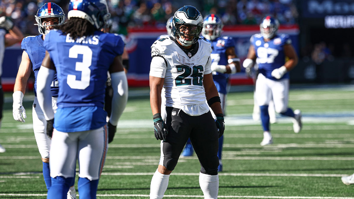 Philadelphia Eagles running back Saquon Barkley (26) reacts after a long run during the second half against the New York Giants at MetLife Stadium