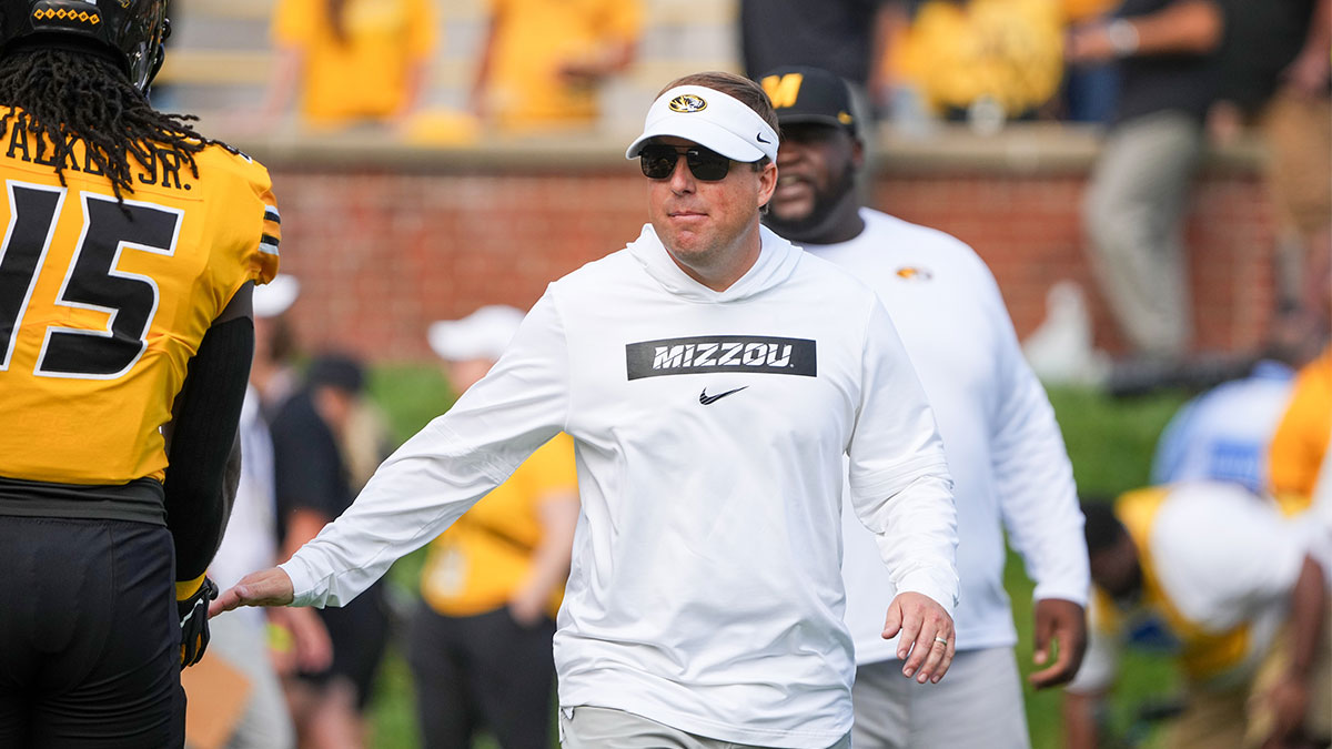 Missouri Tigers head coach Eli Drinkwitz greets players against the Boston College Eagles prior to a game at Faurot Field at Memorial Stadium.